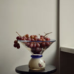 Discover the Modern Vintage Guta Glass Blue + Milk Edition – a handcrafted consignment piece, blending traditional glass artistry with a contemporary aesthetic.