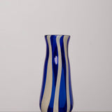 Discover the YAKUSH STRIPS Vase Blue – an 8.6" tall cornflower blue striped vase handmade from recycled glass, perfect for drinks or fresh flowers.