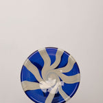 Discover the YAKUSH STRIPS Plate Blue – a 10.6" handcrafted double-walled plate made from recycled glass with bold cornflower blue stripes.