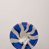 Discover the YAKUSH STRIPS Plate Blue – a 10.6" handcrafted double-walled plate made from recycled glass with bold cornflower blue stripes.