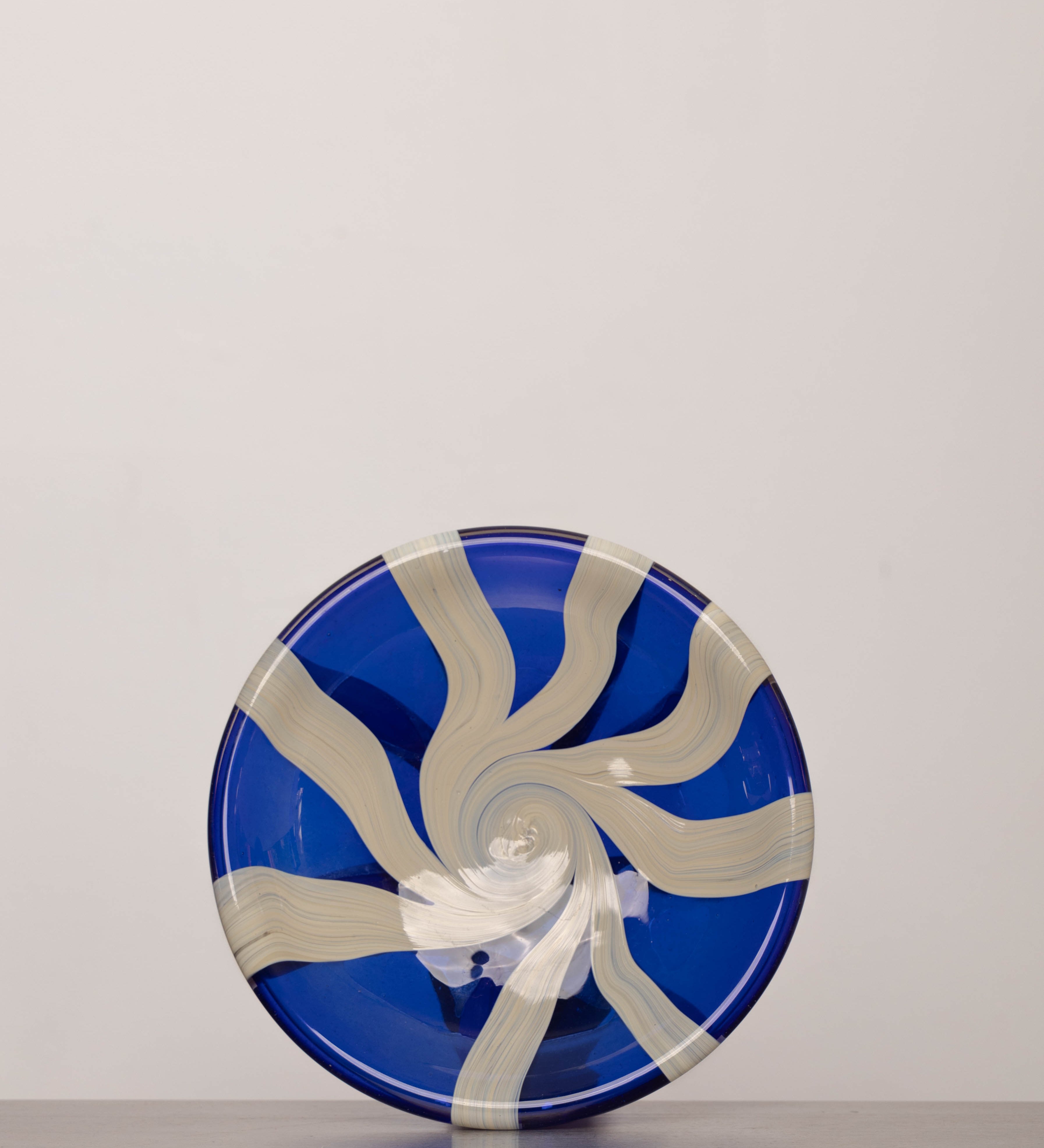 Discover the YAKUSH STRIPS Plate Blue – a 10.6" handcrafted double-walled plate made from recycled glass with bold cornflower blue stripes.