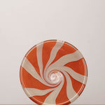 Discover the YAKUSH STRIPS Plate Orange – a 10.6" double-walled recycled glass plate with bold jam orange stripes, handcrafted by Ukrainian artisans.