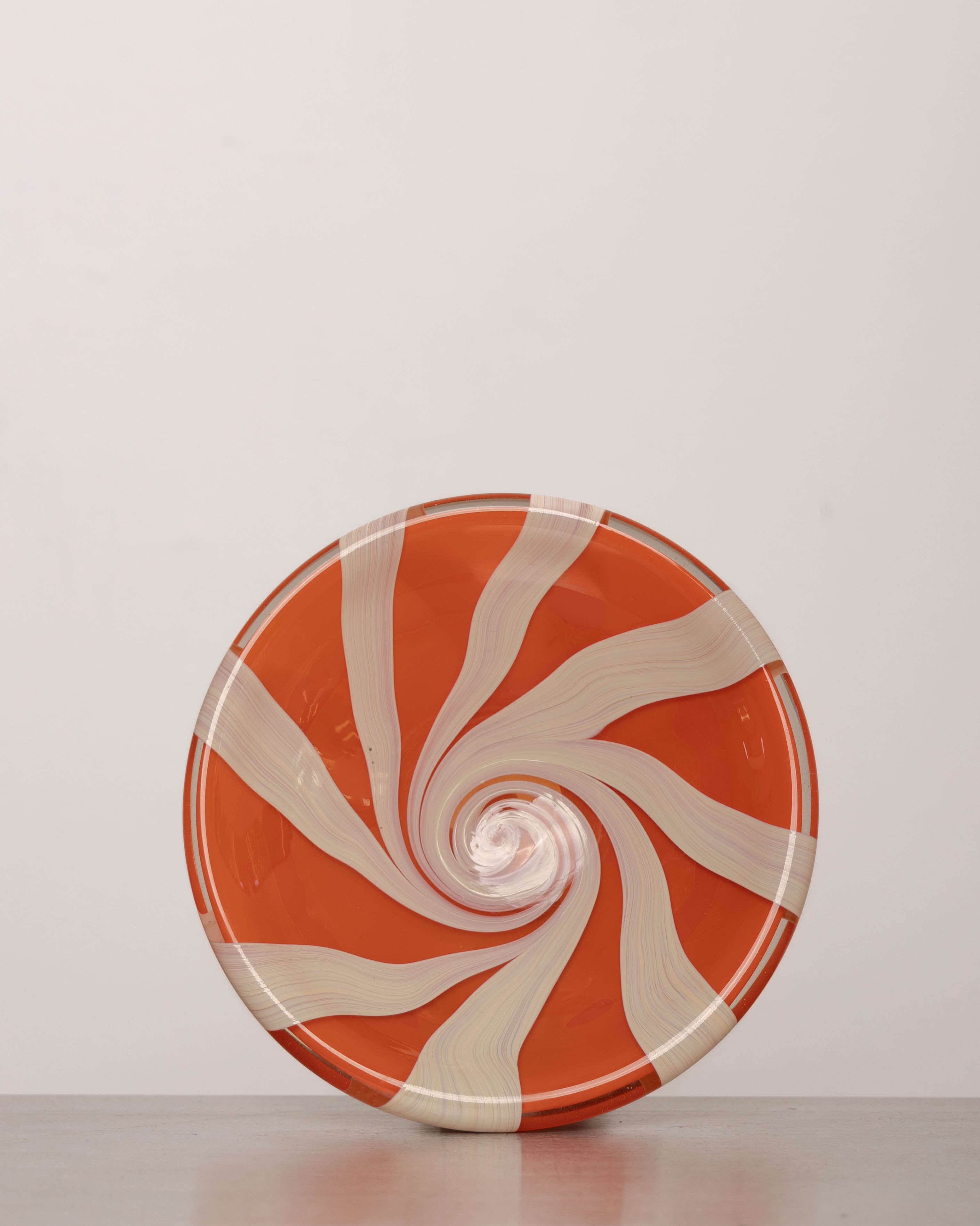 Discover the YAKUSH STRIPS Plate Orange – a 10.6" double-walled recycled glass plate with bold jam orange stripes, handcrafted by Ukrainian artisans.