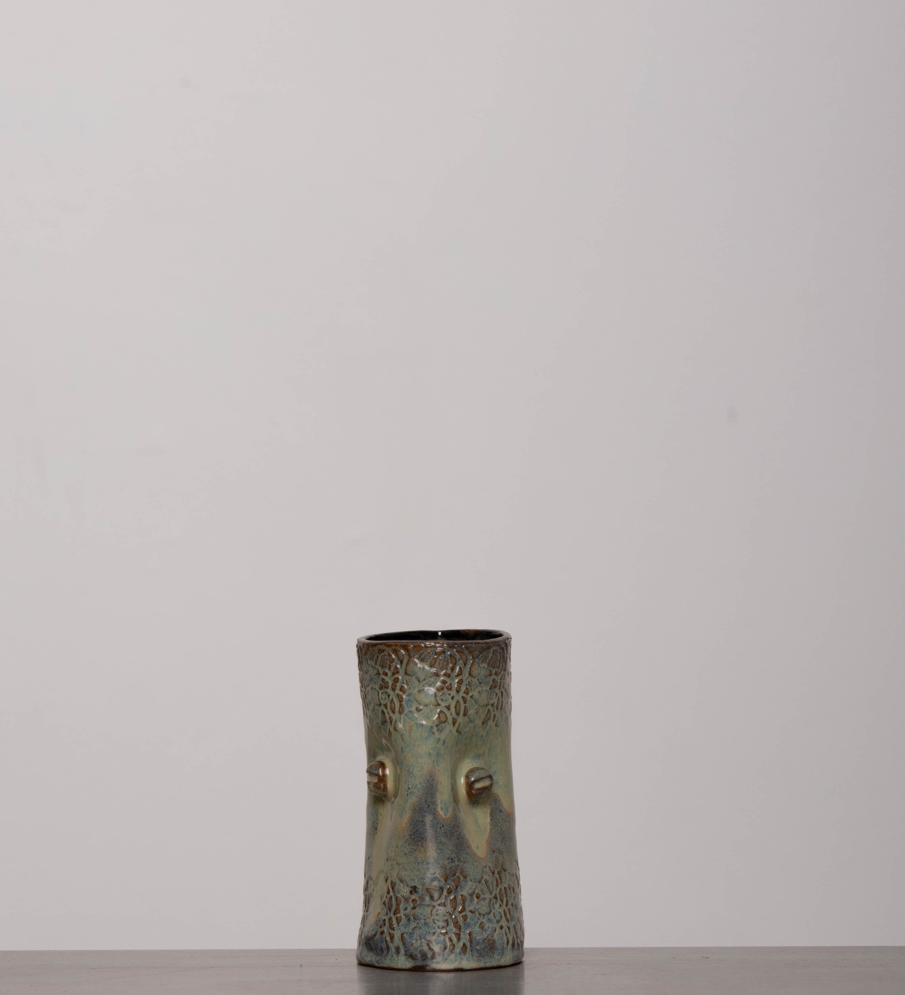 Discover the KKS Glass – a 5.5-inch tall, 3.5-inch wide handmade pottery glass with a 12oz capacity, featuring unique artisanal details.