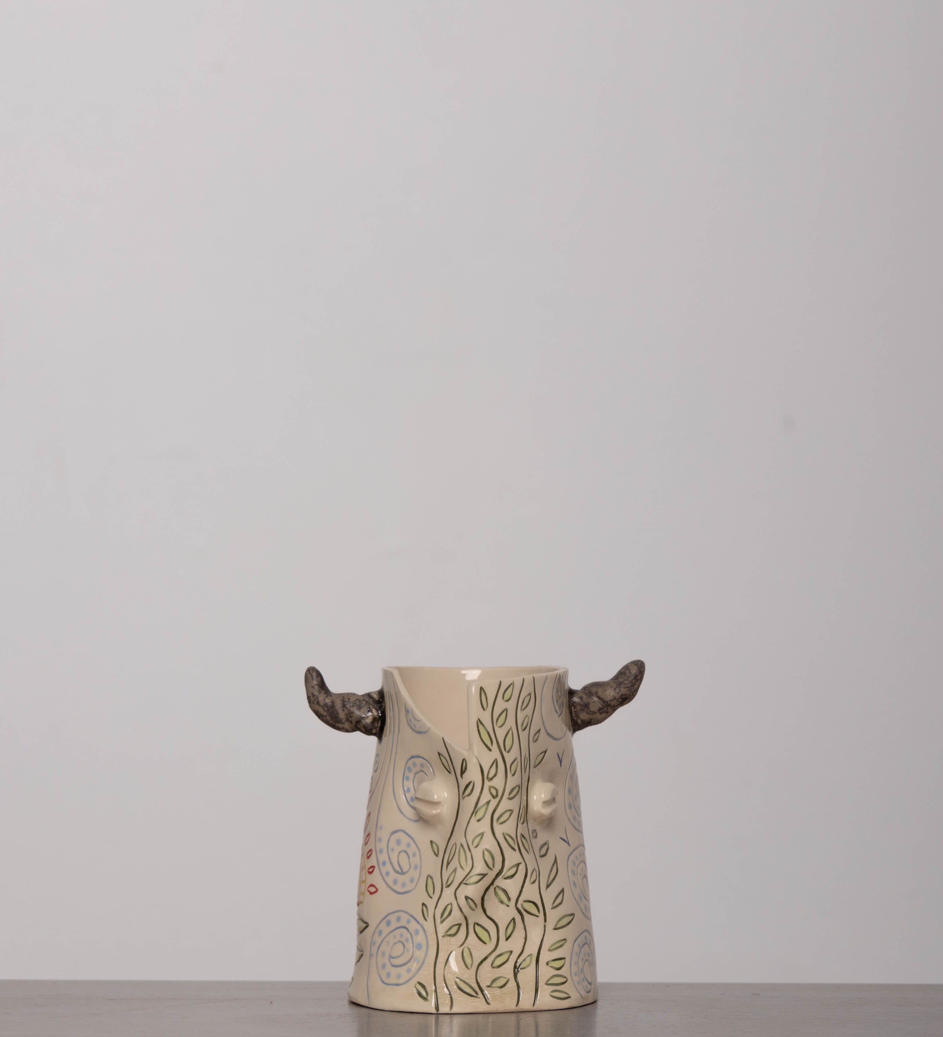 Discover the KKS Bull Vase – a handmade 5.5-inch tall, 4-inch wide ceramic vase, featuring organic artistry and one-of-a-kind craftsmanship.