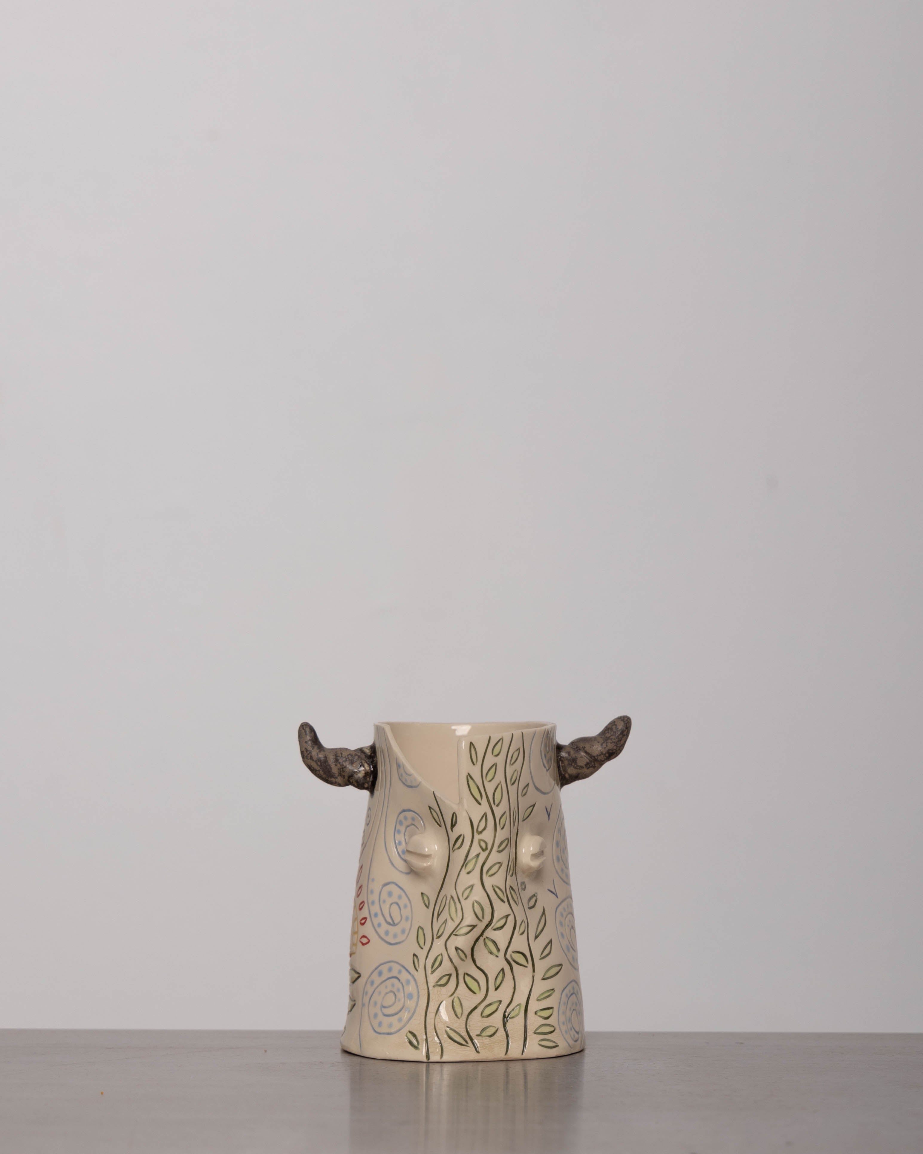Discover the KKS Bull Vase – a handmade 5.5-inch tall, 4-inch wide ceramic vase, featuring organic artistry and one-of-a-kind craftsmanship.