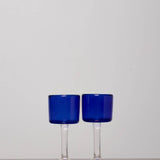 Discover the YAKUSH Wine Glass Blue – a 6.6" tall handcrafted wine glass in rich blue recycled glass, perfect for wine or cocktails.