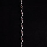 Sterling Silver Wavy Link Bracelet with Oval Garnet Stones