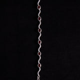 Sterling Silver Wavy Link Bracelet with Oval Garnet Stones