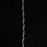 Sterling Silver Wavy Link Bracelet with Oval Garnet Stones