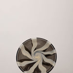 Discover the YAKUSH STRIPS Plate B&W – a 10.6" handcrafted black and white striped double-walled glass plate made from recycled glass.